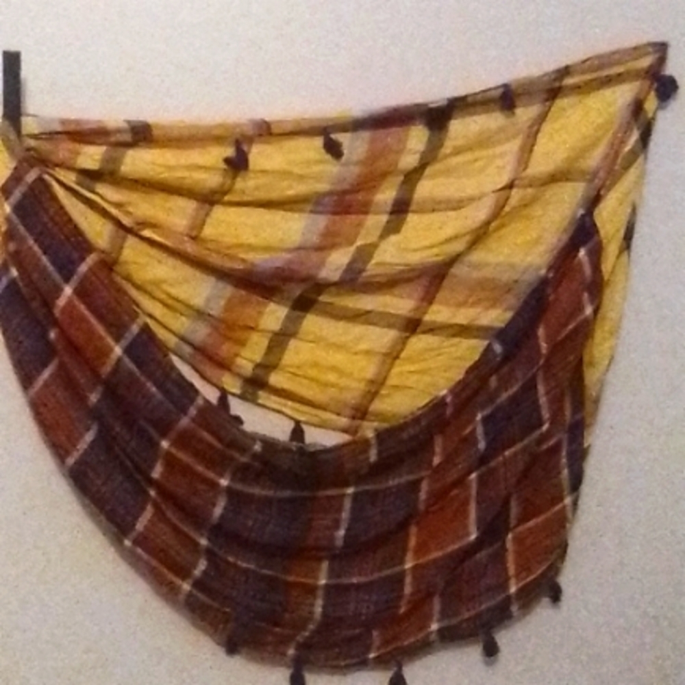 This is a beautiful plaid purple and yellow, wraparound connected scarf